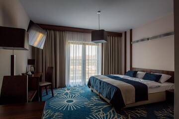 Фото номера Номер Делюкс с кроватью размера «king-size» Курортные отели Kasor Resort &amp; Spa г. Стрыкув 2