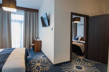 Фото номера Апартаменты с 2 спальнями Курортные отели Kasor Resort &amp; Spa г. Стрыкув 4